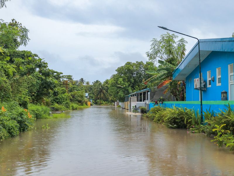 Flooded residential street — illustrative flood photograph